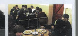 Group eating in camp kitchen
